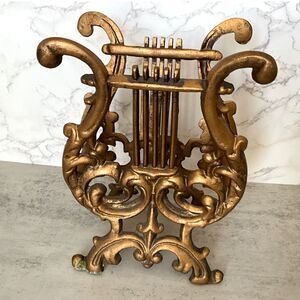 Vintage gold cast metal lyre magazine music rack display stand Hollywood glam